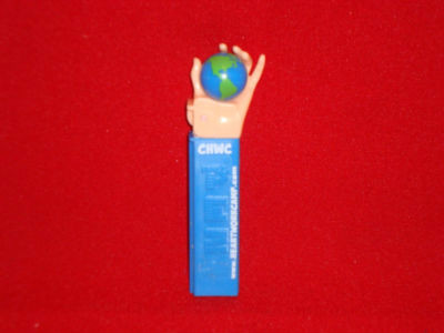 FX Pez Dispenser Globe in Hand Catholic Heart Workcamp Exclusive
