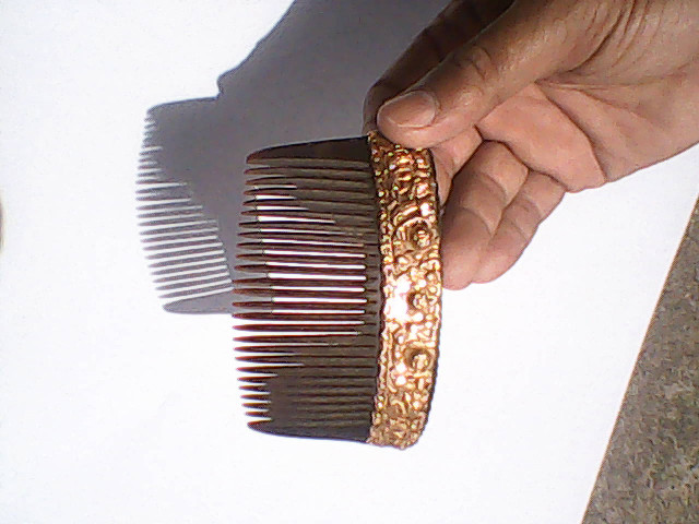 Century old comb made from water buffalo horn with pure gold des