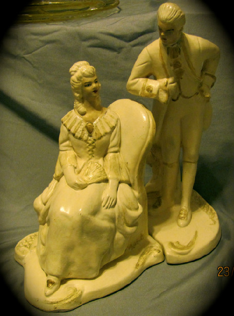 victorian man and woman figurine