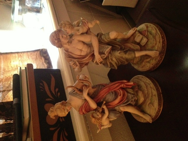 Man and woman cherub statues Man and woman cherub statues