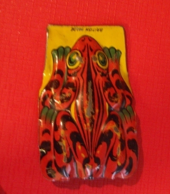 tin clicker toy