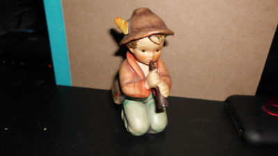 hummel boy playing flute