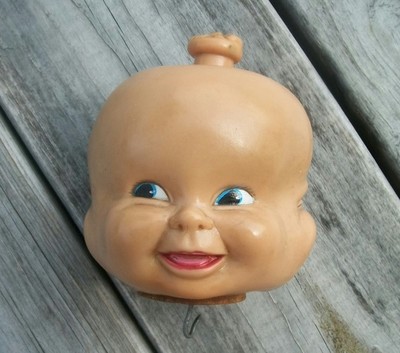 old doll with 3 faces