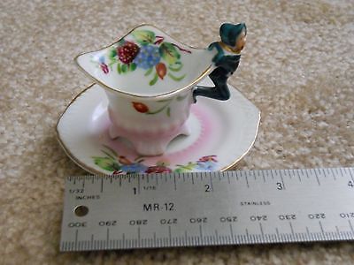miniature china cups and saucers