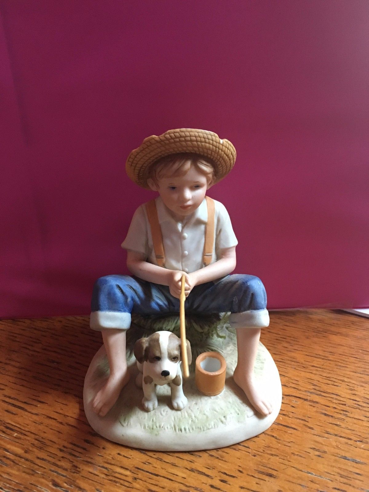 boy fishing figurine