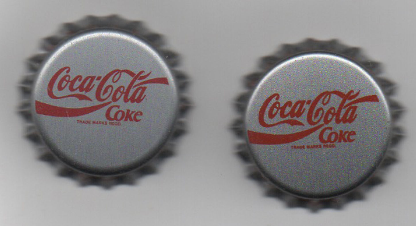*S* 2 DIFFERENT COCACOLA PROMOTIONAL BOTTLE CAPS FROM CURACAO UNUSED