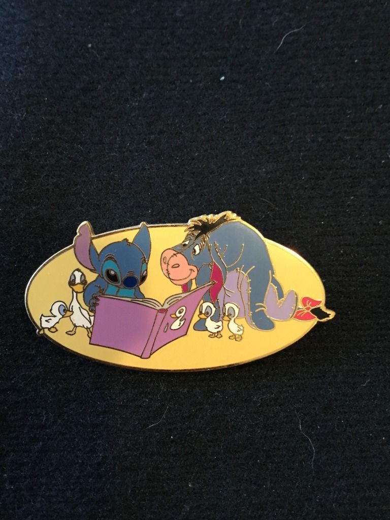 stitch reading a book figurine