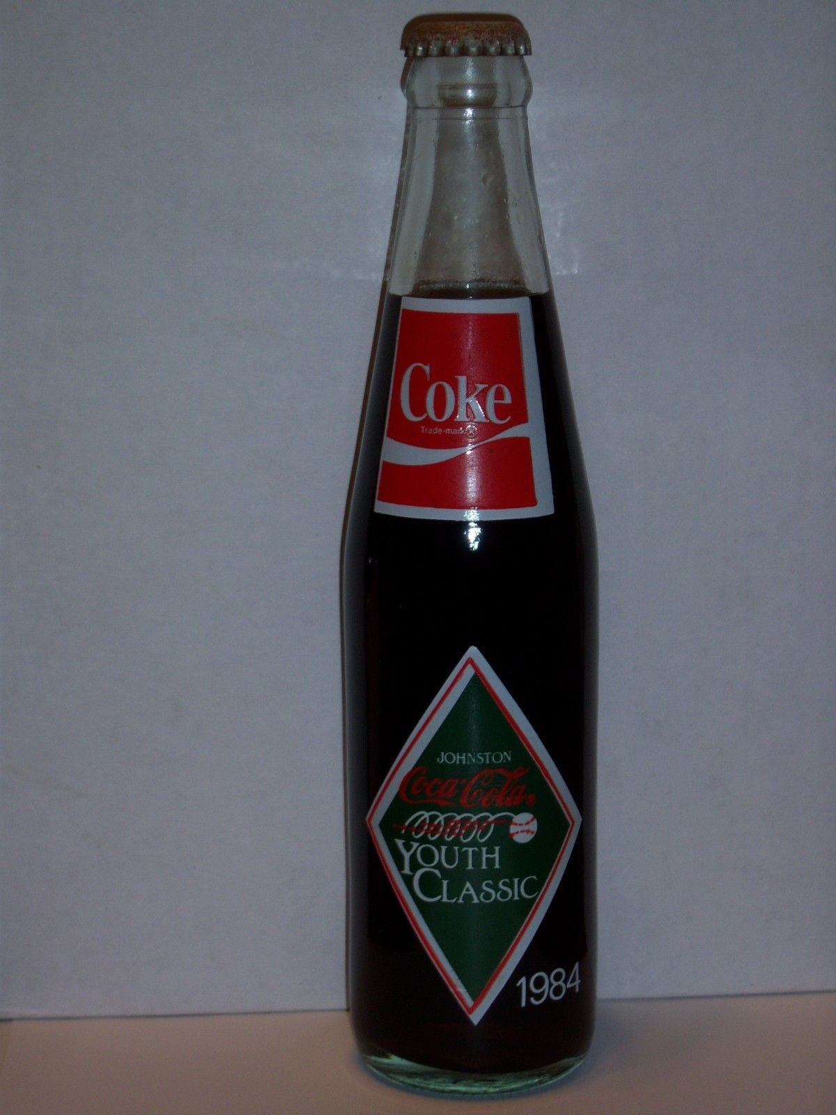 10 OZ COCA COLA COMMEMORATIVE BOTTLE 1984 JOHNSON''S COCA COLA YOUTH