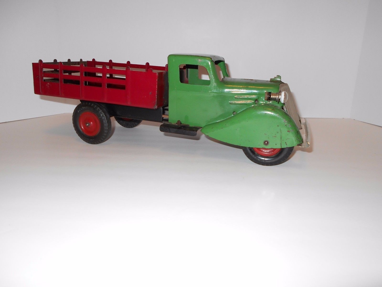 wyandotte-pressed-steel-stake-bed-truck-with-electric-headlights