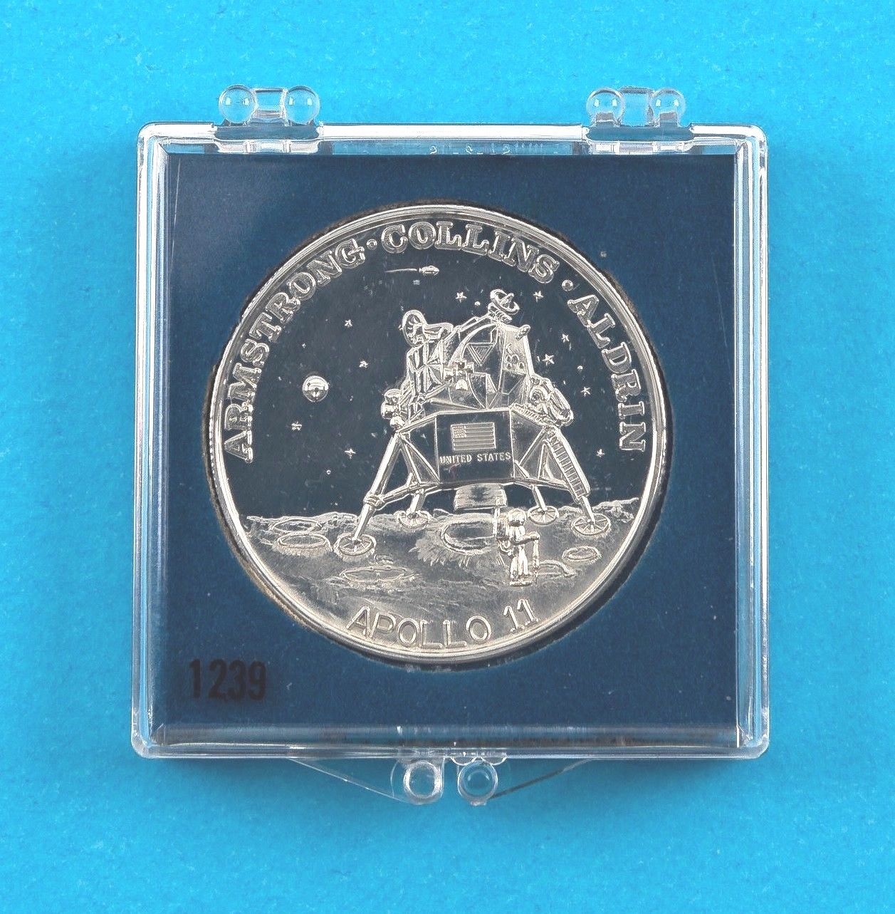 APOLLO 11 COMMEMORATIVE COIN, MAN''S FIRST STEPS ON MOON .999 SILVER W