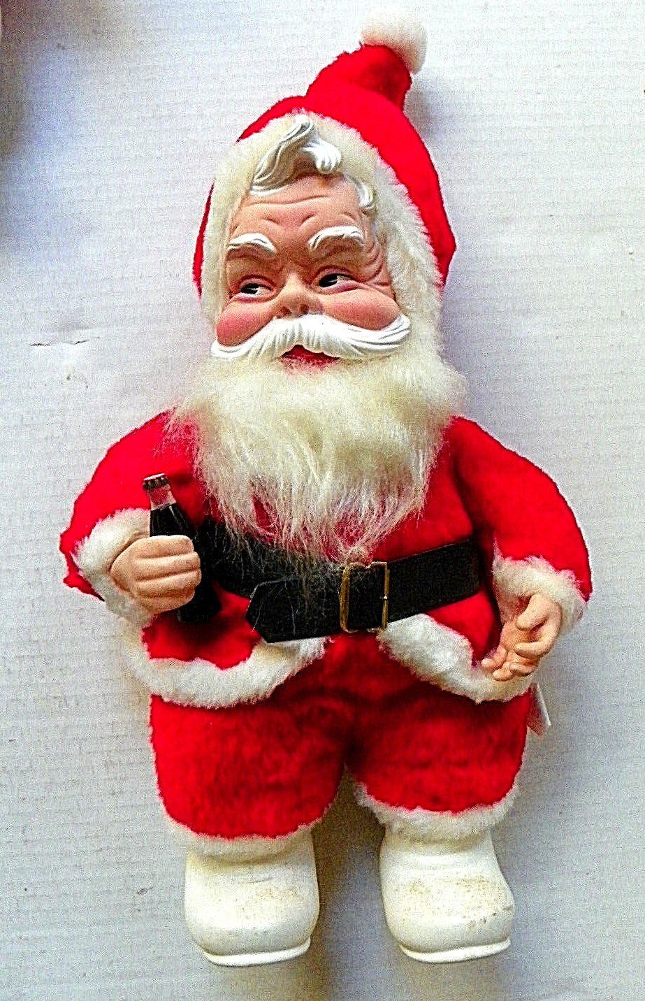 vintage stuffed santa holding coke bottle
