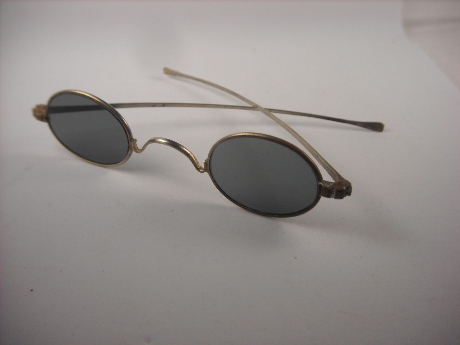 Antique eyeglasses. Sunglasses from the early 1900''s. Small spectacles ...