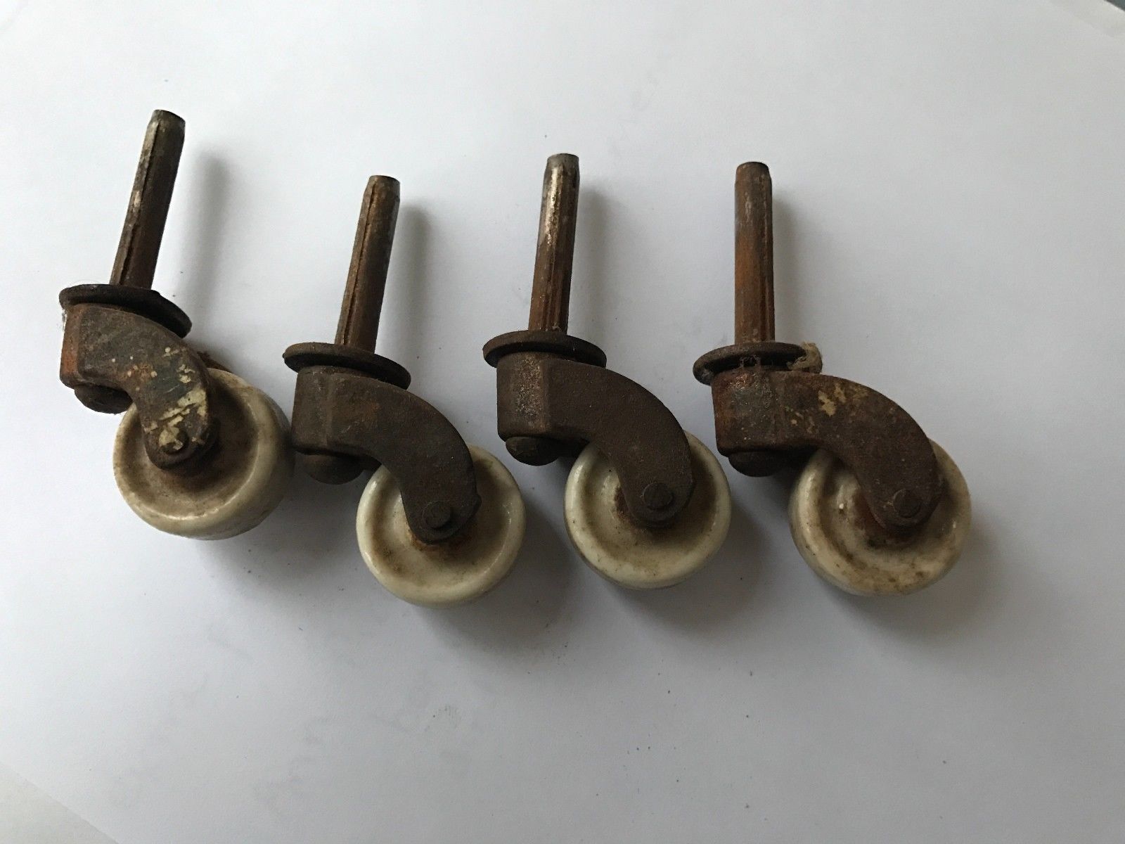 4 Antique Vintage Porcelain Casters/ Wheels 1" diameter Antique