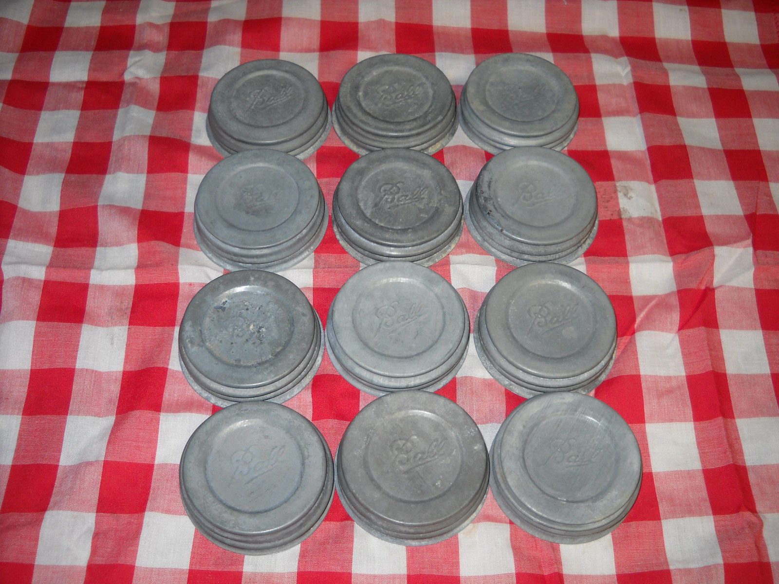 LOT OF 12 VINTAGE "BALL" CANNING JAR ZINC METAL LIDS W/MILK GLASS