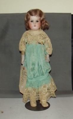 antique porcelain doll with cloth body