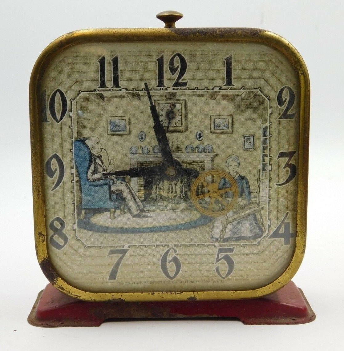 Antique Lux Clock Co. Red Metal Spinning Wheel Lithograph Alarm Clock