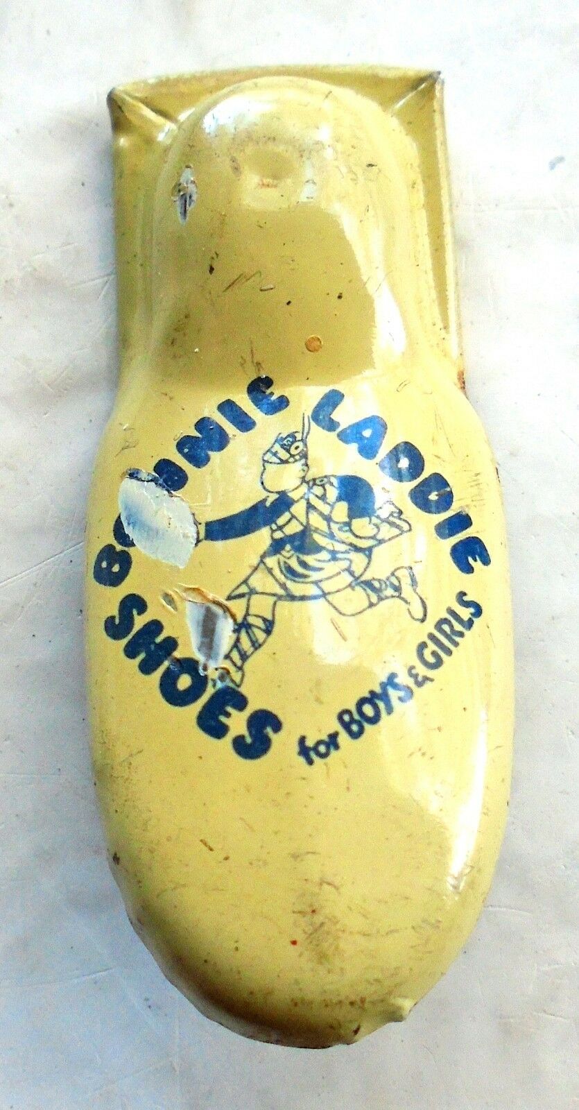 tin clicker toy