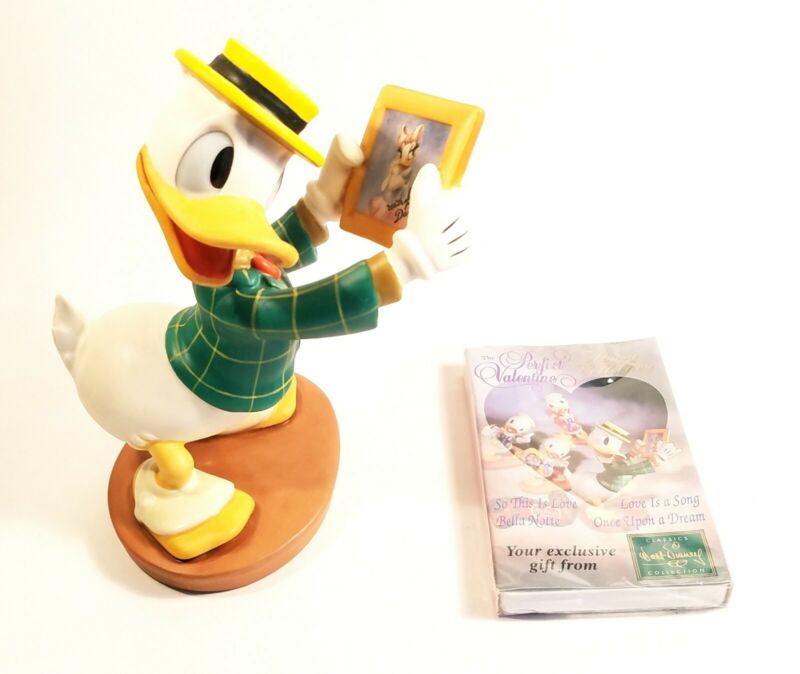 donald and daisy duck figurines